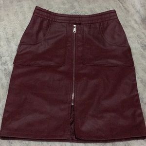 A burgundy pleather skirt